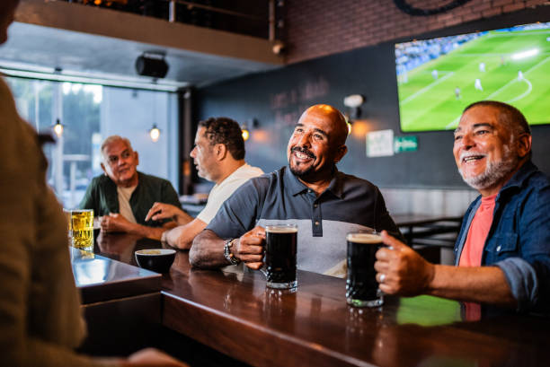 istock Senior friends talking with waiter on the bar 2157552504