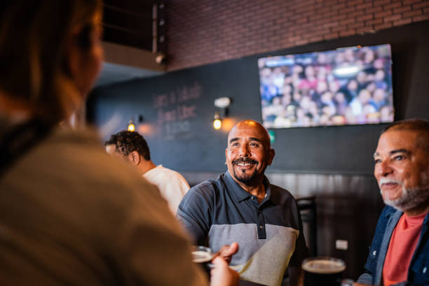 istock Senior friends talking with waitress on the bar 2157552507