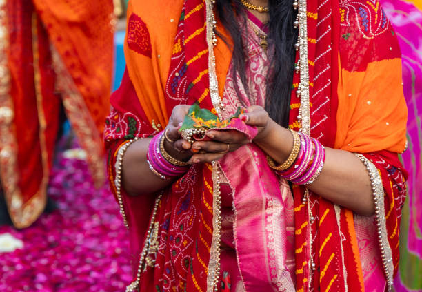 istock indian devotee doing holy rituals at chhath festival at morning 2157552549