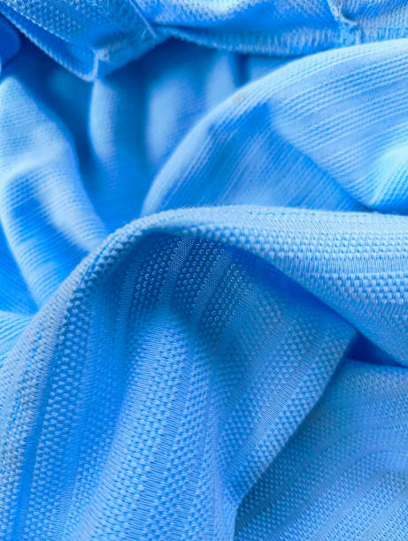 istock Blue clothing fabric texture or sports cloth or thread closeup textile background. 2157557942