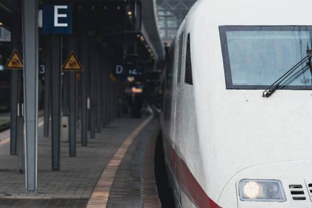 istock High-speed train at a modern railway station platform on a rainy day 2157559475