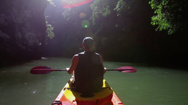 istock Kayaker enjoys paddling in azure river water in canyon 2157561069