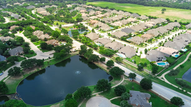 istock Large vacant land in upscale master planned community with extra-large expensive two-story suburban house with swimming pool, pond near downtown Southlake suburbs Dallas Fort Worth, Texas, aerial 2157561208