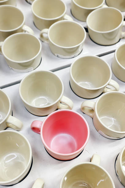 Empty coffee cups in a row on a counter top