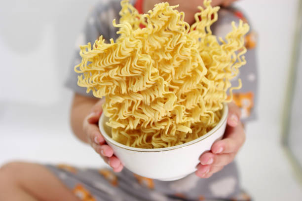 istock dry noodles, egg noodles, isolated on a white background 2157564485
