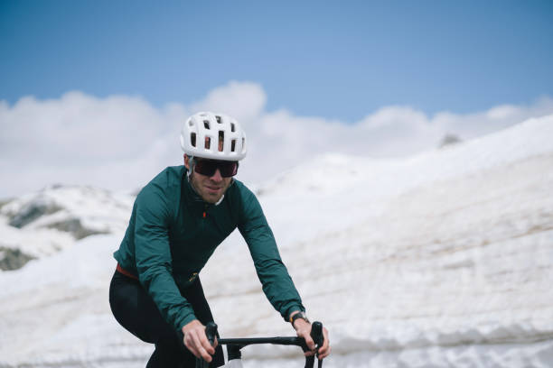 istock Road biker rides to high mountain pass, Gotthard Pass 2157566225