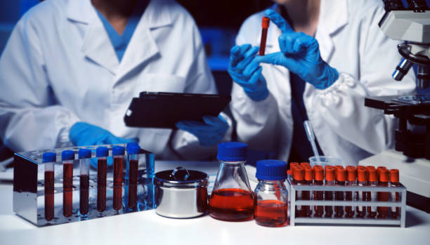 istock professional chemist woman laboratory using scientific microscope for science research, chemistry scientist with microbiology medicals equipment technology to working with medicine biology experiment 2157568440