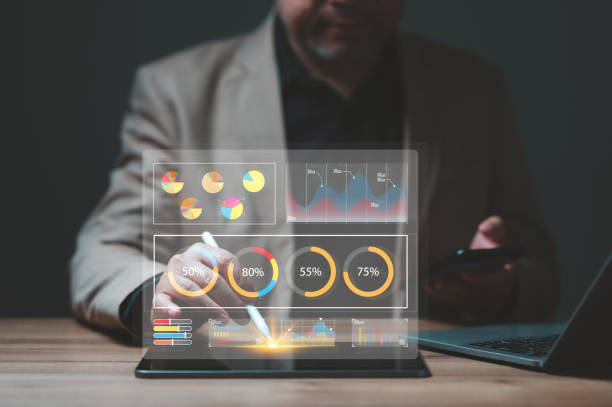istock A businessman is pointing on a tablet with a pen, and the virtual screening is a graph with many different colored bars 2157570970