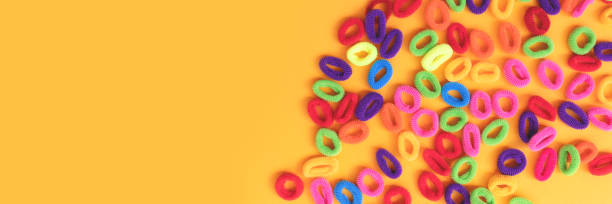 istock Banner with small multicolored hair scrunchies. 2157574563