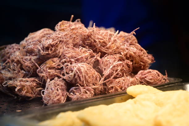 Crispy deep-fried shredded taro, a popular Taiwanese night market snack, features taro strips battered and fried to perfection, offering a crispy exterior and soft interior.