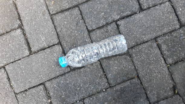 istock Plastic bottle on the paving block floor. 2157577079