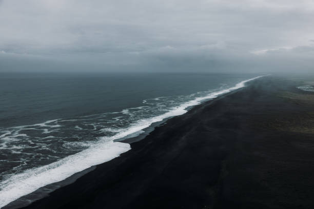 Dramatic view of blacks and beach and stormy ocean from above in Dyrholaey, South Iceland