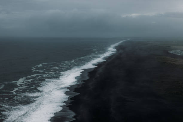 istock Aerial View of Mystical Endless Panoramic Black Sand Beach 2157577248