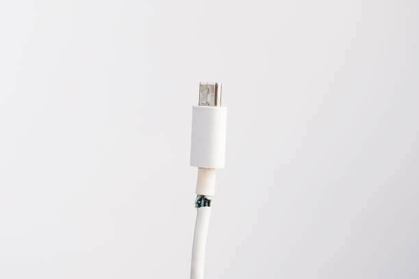 istock Torn cord for charging a mobile phone type si on a white background. Copy space. 2157577321