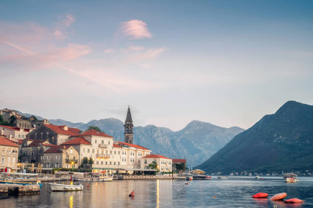 Picturesque town of Perast in the Bay of Kotor Evening panoramic view of the picturesque town of Perast in the Bay of Kotor with the promenade, beautiful historic buildings and boats, Montenegro. montenegro stock pictures, royalty-free photos & images