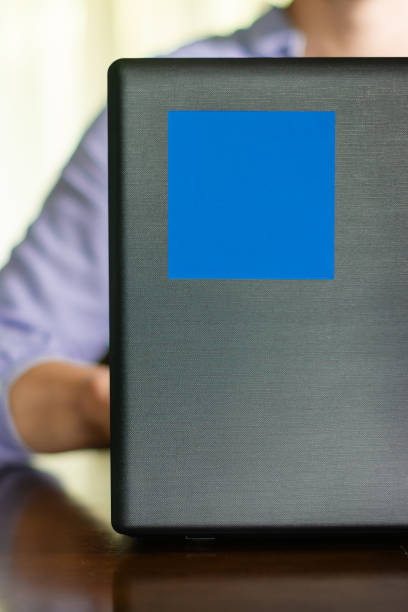 istock Blue sticky note on laptop whit woman in background 2157582438