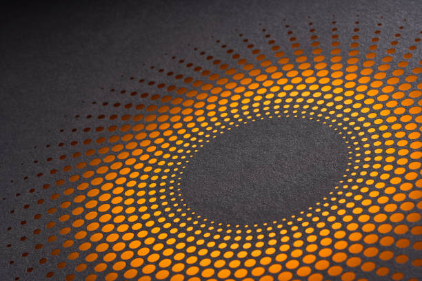 Striking radial pattern of orange perforated dots on dark background creating a vibrant sunburst effect