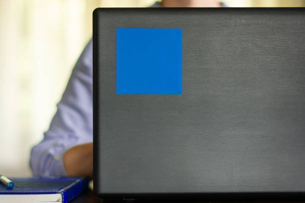 istock Blue sticky note on laptop whit woman in background 2157582810