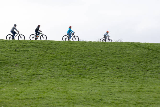 Group of kids riding bicycles isolated on white background
