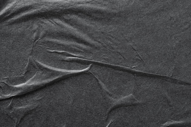 istock Black paper with folds, Paper texture. 2157584233