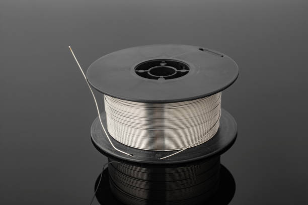 istock Spool of stainless wire for a welding machine on a black background. 2157584248