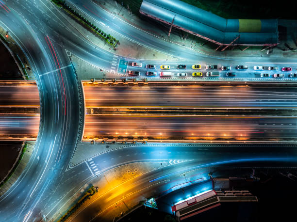 istock Expressway top view, Road traffic an important infrastructure, Drone aerial view fly in circle, traffic transportation, Public transport or commuter city life concept of economic and energ, transport. 2157585111