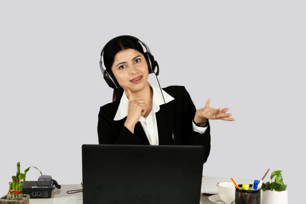 istock Beautiful Asian Indian Receptionist with headset customer care service 2157586108