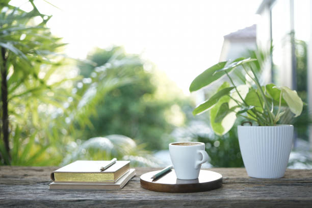 istock small white cup and notebook and plant pot balcony outdoor 2157590548