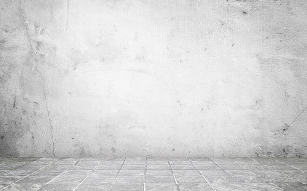 istock grey concrete perspective room for advertising. stamp concrete floor in grid pattern with weathered white concrete wall background. white backdrop space for displayed product. 2157590847