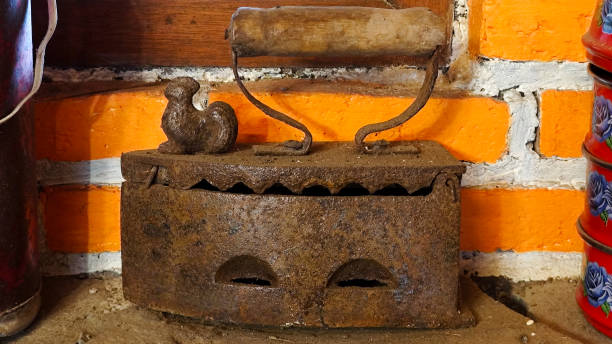 Vintage Iron Press on Rustic Brick Wall Background Indonesian Traditional House