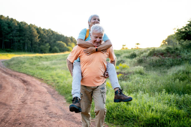 istock Playful senior couple having fun in nature 2157601304