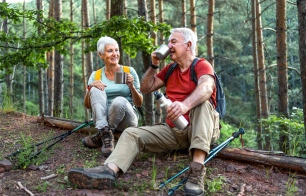 istock Senior couple of hikers taking a break 2157602573