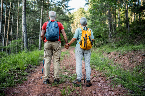 istock Senior couple hiking in the forest 2157602717