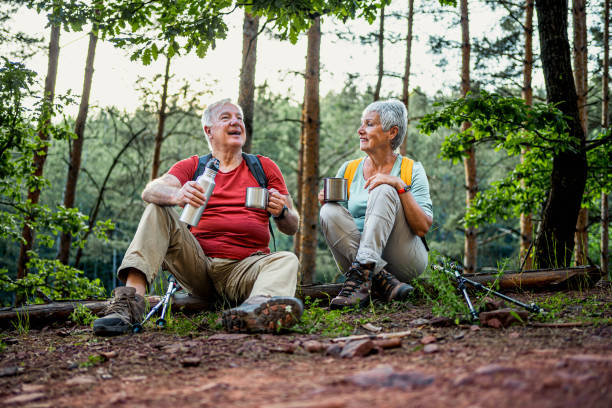 istock Senior couple of hikers taking a break 2157602834