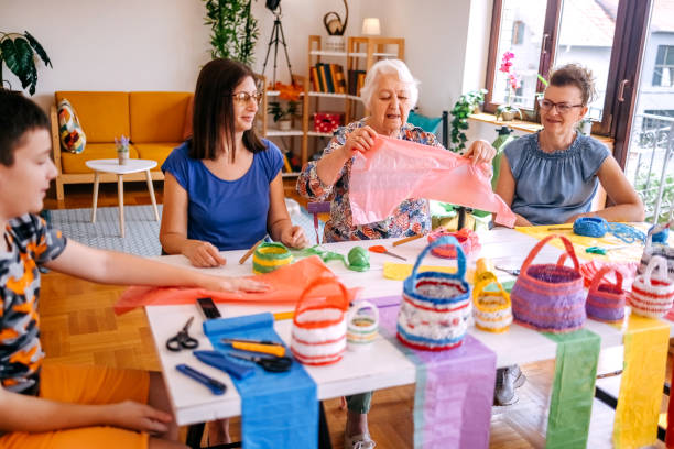 istock Family members have an interesting hobby of making decorative baskets using plastic bags 2157605795