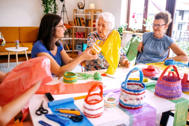 istock Family members have an interesting hobby of making decorative baskets using plastic bags 2157605799