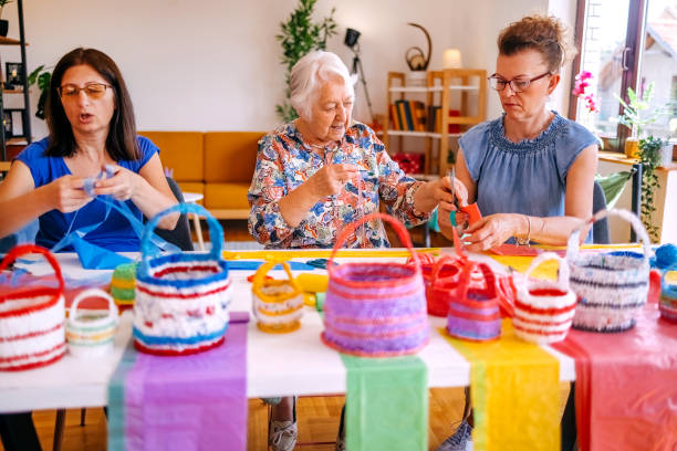 istock Family members have an interesting hobby of making decorative baskets using plastic bags 2157605855