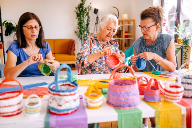istock Family members have an interesting hobby of making decorative baskets using plastic bags 2157606047