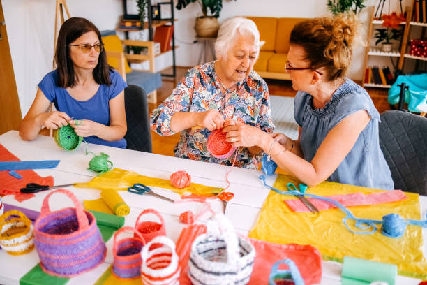 istock Family members have an interesting hobby of making decorative baskets using plastic bags 2157606183