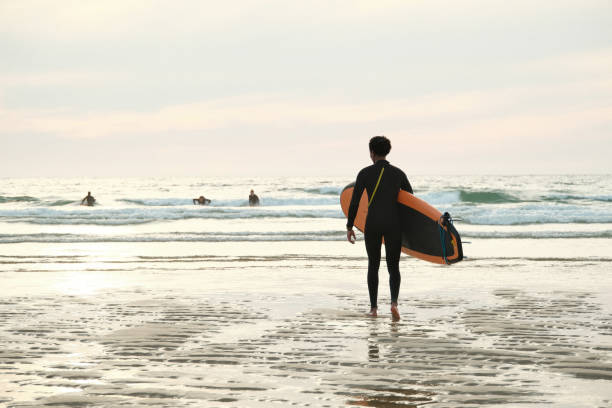 istock Portrait of surfer on beach 2157607681