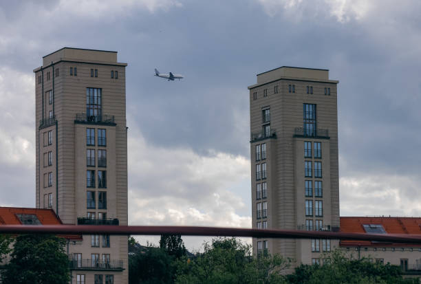 an airplane is seen between two towers