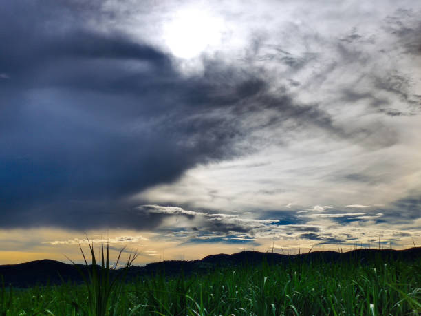 Sunset in a cloudy sky at the farm, nature landscape