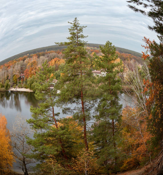 Autumn fish-eye panorama view on river with colorful trees on riverbanks. Autumnal Siverskyi Donets River in Ukraine