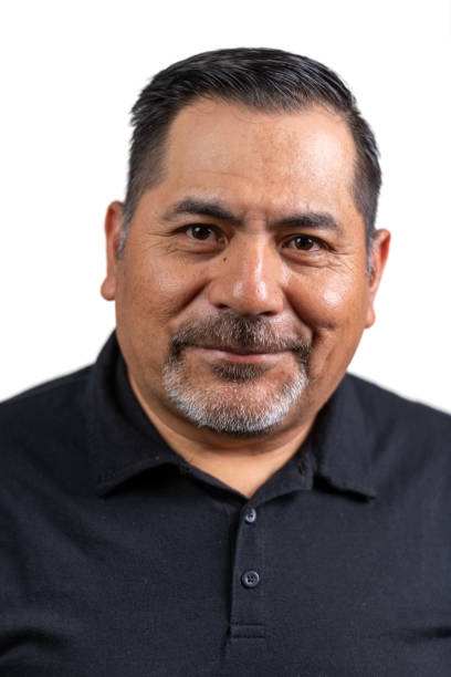 istock Smiling hispanic mature man posing looking at the camera isolated on white background 2157616070
