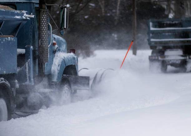 istock Snow plows clearing residential streets during a blizzard 2157616404