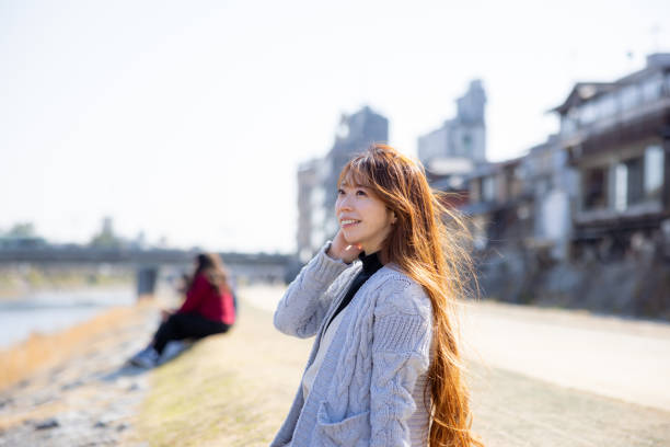 istock Female tourist sitting on river side 2157628827