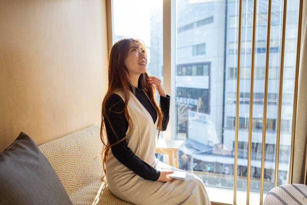 istock Woman relaxing in Internet cafe 2157628835