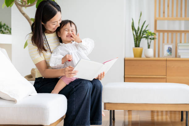 istock Parent and child reading a picture book 2157630556