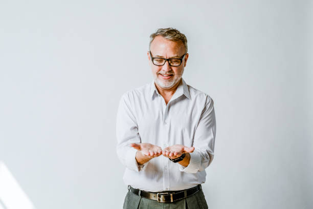 istock Mature man looking at his palms 2157630698
