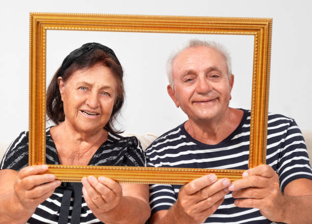 istock Senior couple portrait holding frame 2157632818